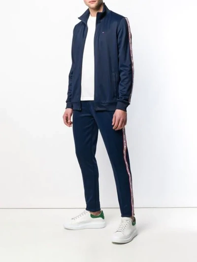 Shop Tommy Jeans Logo Tape Track Pants In Blue