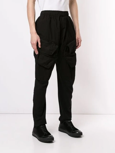 Shop Julius Tapered Leg Cargo Trousers In Black