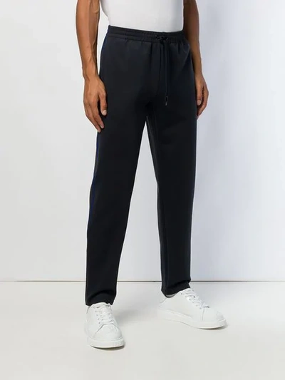 Shop Versace Jogging Trousers In Black