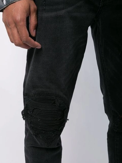 Shop Amiri Mx1 Broken Patch Jeans In Aged Black