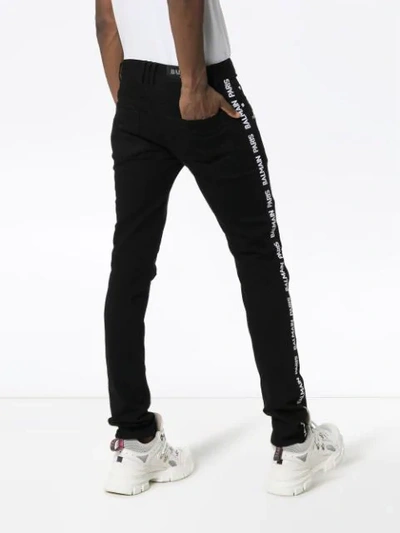 Shop Balmain Slim Leg Logo Stripe Biker Jeans In Black