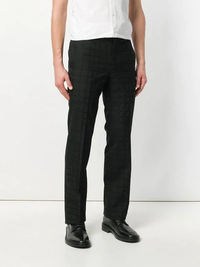 Shop Givenchy Eyelet Check Trousers In Black