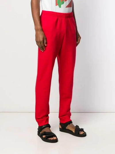 Shop Msgm Tapered Joggers In Red