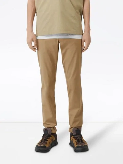 Shop Burberry Slim Fit Icon Stripe Detail Cotton Chinos In Brown