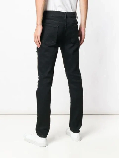 Shop Overcome Distressed Slim Jeans In Black