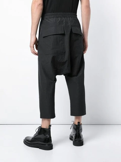 Shop Rick Owens Cropped Dropped Crotch Trousers In Black