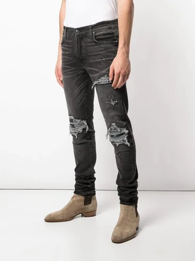 Shop Amiri Slim Distressed Jeans In Black