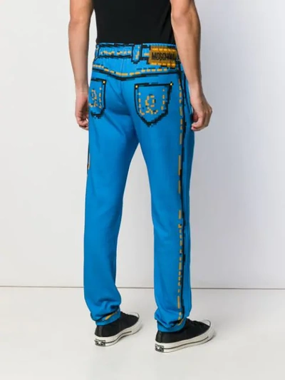 Shop Moschino Printed Track Pants In 1302