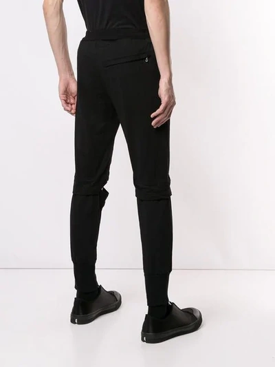 Shop Julius Cut-out Detail Track Pants In Black