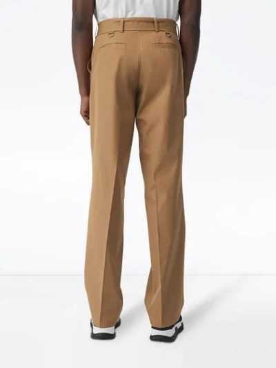 Shop Burberry D-ring Detail Belted Cotton Trousers In Neutrals