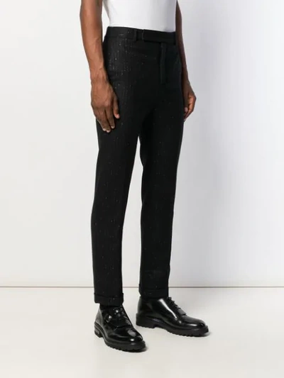 Shop Saint Laurent Metallic Pinstripe Tailored Trousers In Black