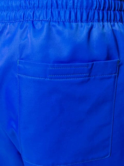 Shop Prada Logo Patch Cropped Trousers In Blue