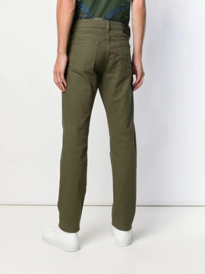 Shop Versus Embroidered Details Trousers In Green