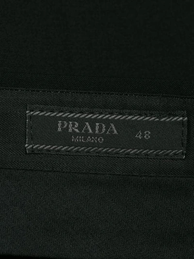 Shop Prada Stretch Slim-fit Trousers In Black