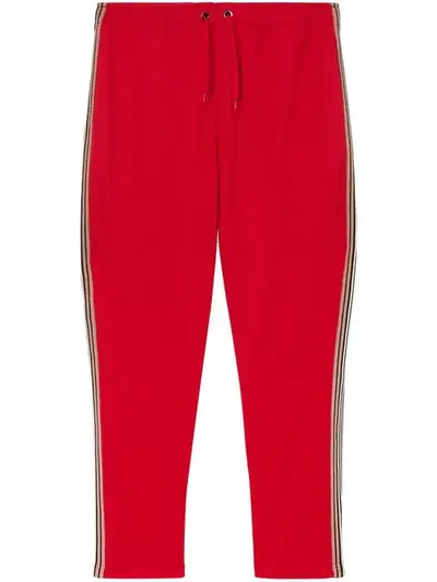 Shop Burberry Icon Stripe Detail Jersey Trackpants In Red