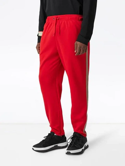 Shop Burberry Icon Stripe Detail Jersey Trackpants In Red