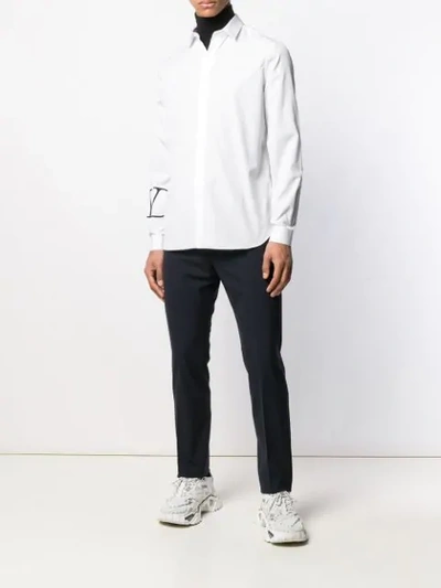 Shop Valentino Small Logo Print Curved Hem Shirt In White
