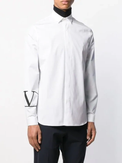 Shop Valentino Small Logo Print Curved Hem Shirt In White