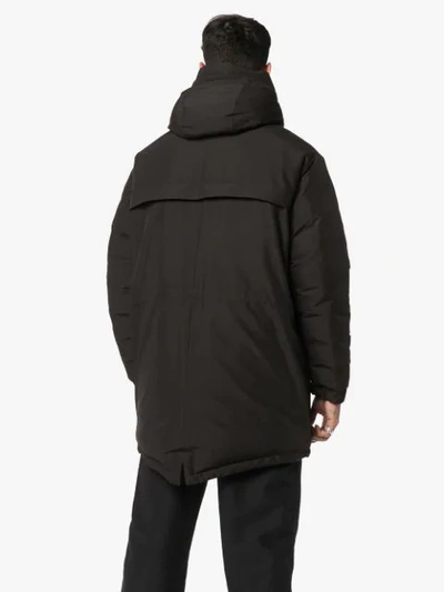 Shop Moncler Logo Parka Coat - Black