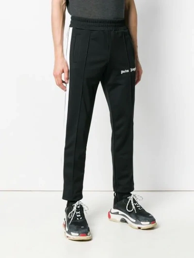 Shop Palm Angels Logo Print Track Pants - Black