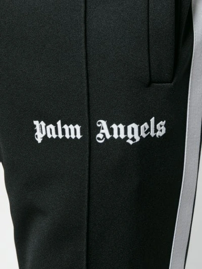 Shop Palm Angels Logo Print Track Pants - Black