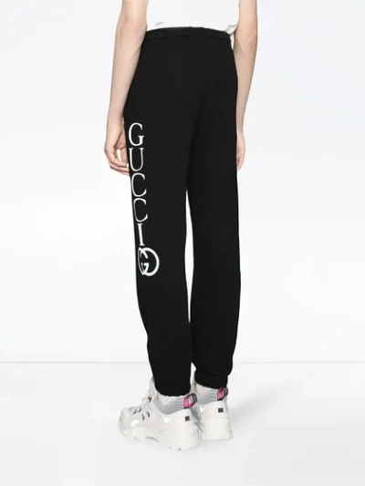 Shop Gucci Jogging Pants With  Print In Black