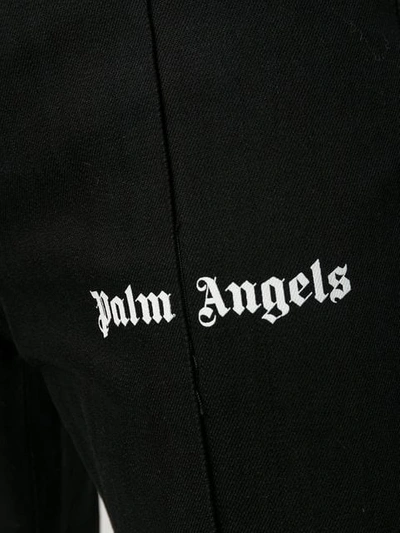 Shop Palm Angels Logo Print Jeans In Black
