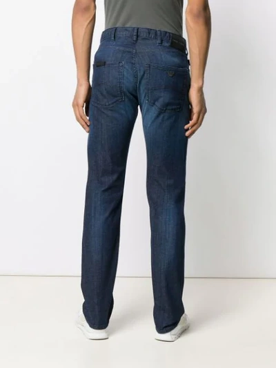 Shop Emporio Armani Faded Slim Jeans In Blue