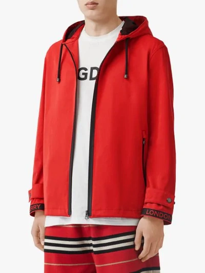 Shop Burberry Logo Detail Nylon Cotton Twill Hooded Jacket In Red
