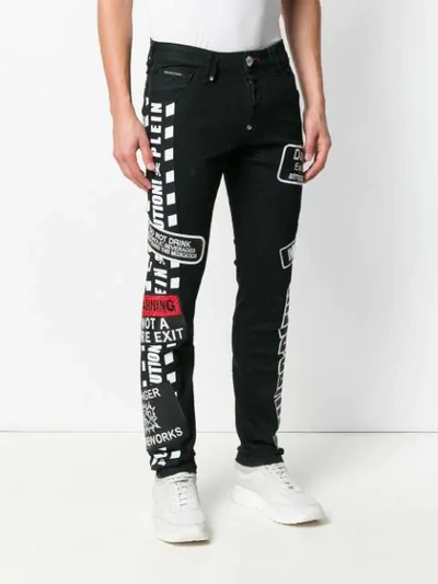 Shop Philipp Plein Warning Jeans In Black