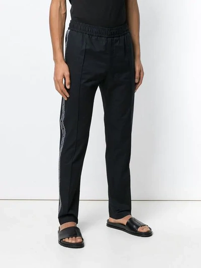 Shop Versace Relaxed Fit Track Pants In Black