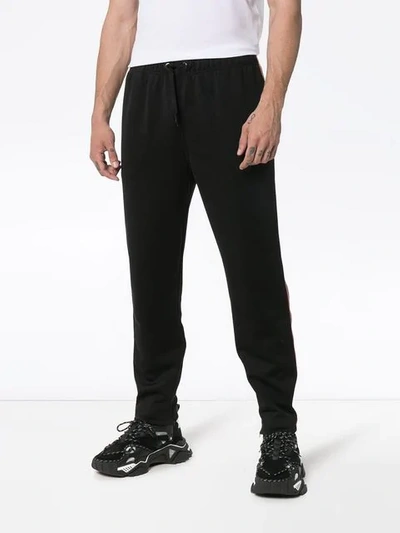 Shop Burberry Icon Stripe Jersey Trackpants In Black