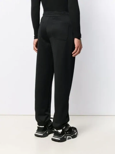 Shop Givenchy Zipped Pocket Track Pants In Black
