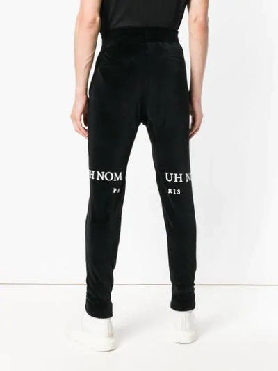 Shop Ih Nom Uh Nit Logo Printed Track Pants In Black