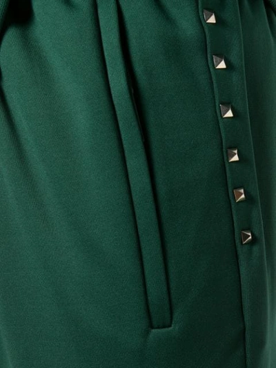Shop Valentino Rockstud Track Pants In Green