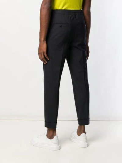 Shop Neil Barrett Elasticated Tapered Trousers In Blue