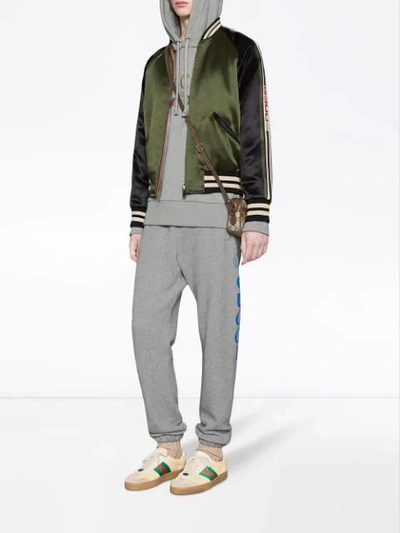 Shop Gucci Reversible Bomber Jacket With Printed Sleeves In Green