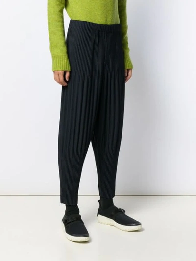 Shop Issey Miyake Pleated Tapered Trousers In Blue