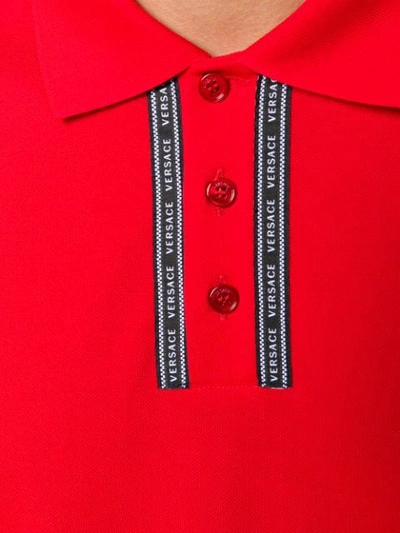 Shop Versace Logo Embellished Polo Shirt - Red