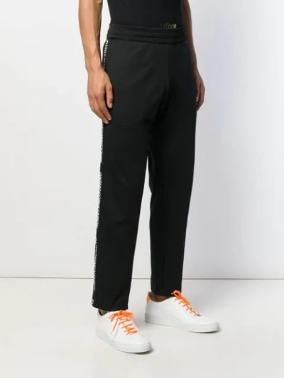 Shop Moschino Side Tape Detail Track Pants In Black
