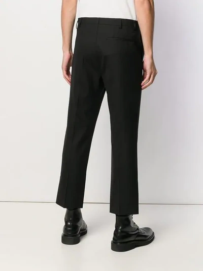 Shop Raf Simons Cropped Tailored Trousers In Black