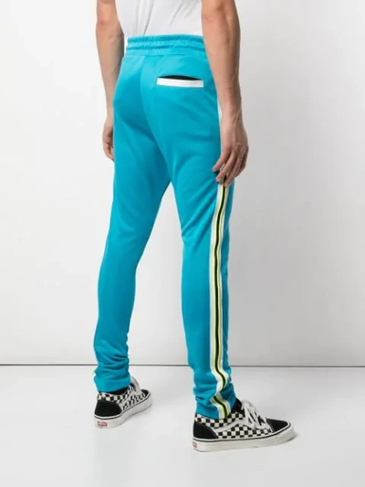 Shop Amiri Skinny Fit Track Trousers - Blue