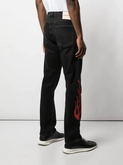 Shop Lost Daze Red Flame Jeans In Black