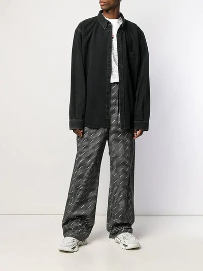 Shop Balenciaga Wide-leg Logo Print Trousers In Black