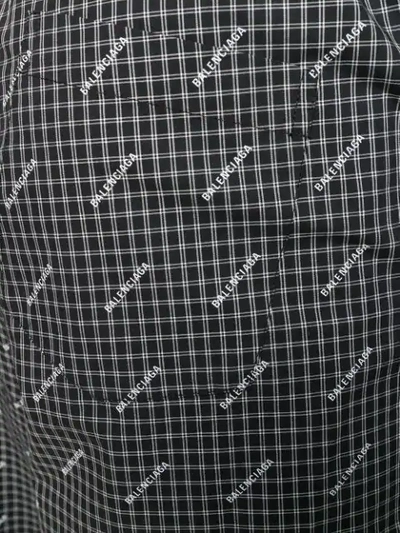 Shop Balenciaga Wide-leg Logo Print Trousers In Black