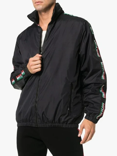 Shop Moschino Logo Sleeve Sport Jacket In Black
