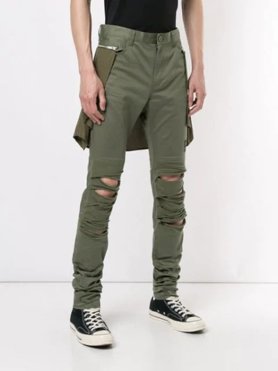 Shop Undercover Distressed Skinny Trousers In Green