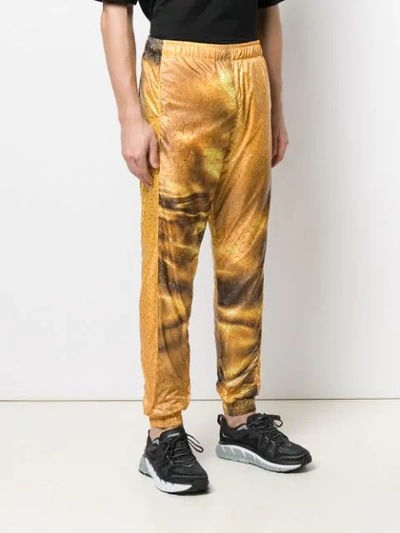 COTTWEILER LOGO PRINT TRACK PANTS - 黄色