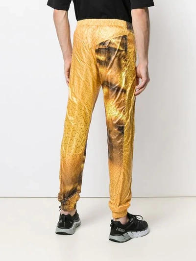 Shop Cottweiler Logo Print Track Pants In Yellow