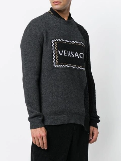 Shop Versace Asymmetric Logo Jumper In Grey